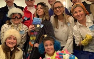 A Murder in the Alps mystery party group in ski gear having a party