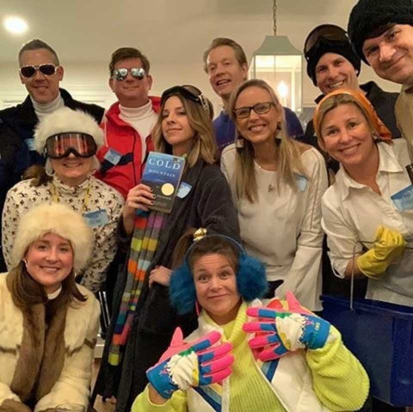 Murder in the Alps Party Group A Murder in the Alps mystery party group in ski gear having a party